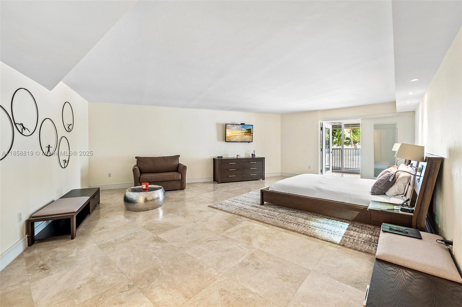 600 Grapetree Drive, Unit 3BS Key Biscayne, FL 33149 - Photo 17 of 47 a bedroom with furniture and a window