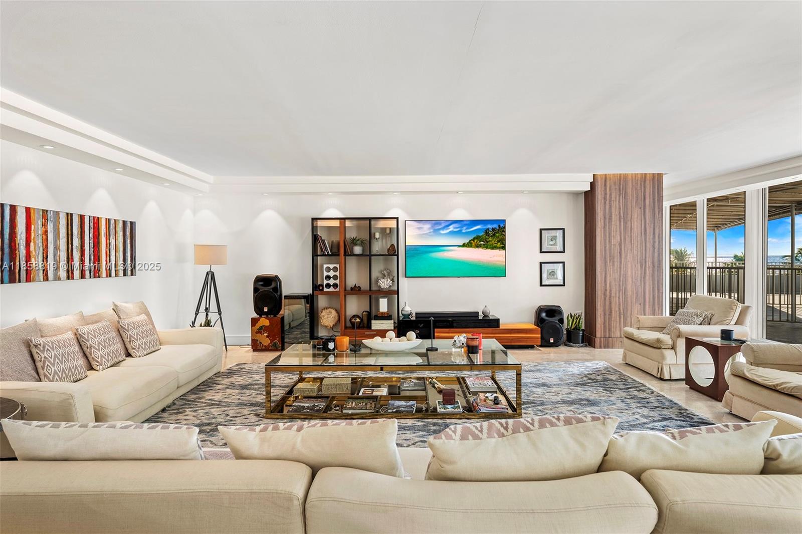 600 Grapetree Drive, Unit 3BS Key Biscayne, FL 33149 - Photo 3 of 47 a living room with furniture and a flat screen tv