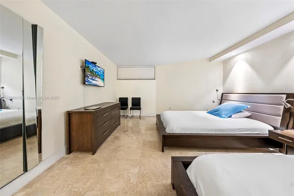 a bed room with a bed and a night stand