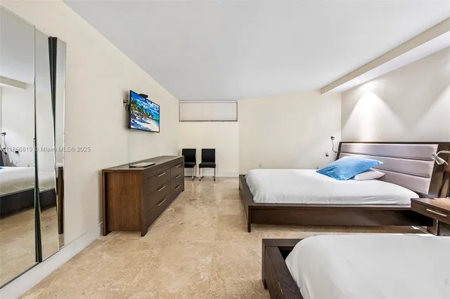 a bed room with a bed and a night stand