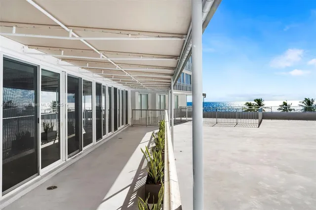 a front view of a building with garden