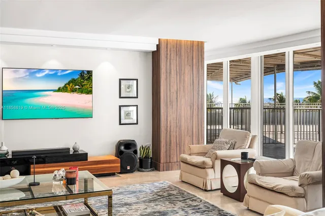 a reading room with furniture lamp and large window