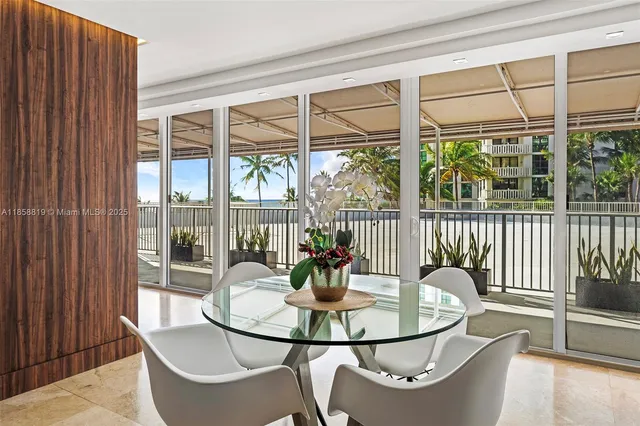a dining room with furniture wooden floor and a potted plant