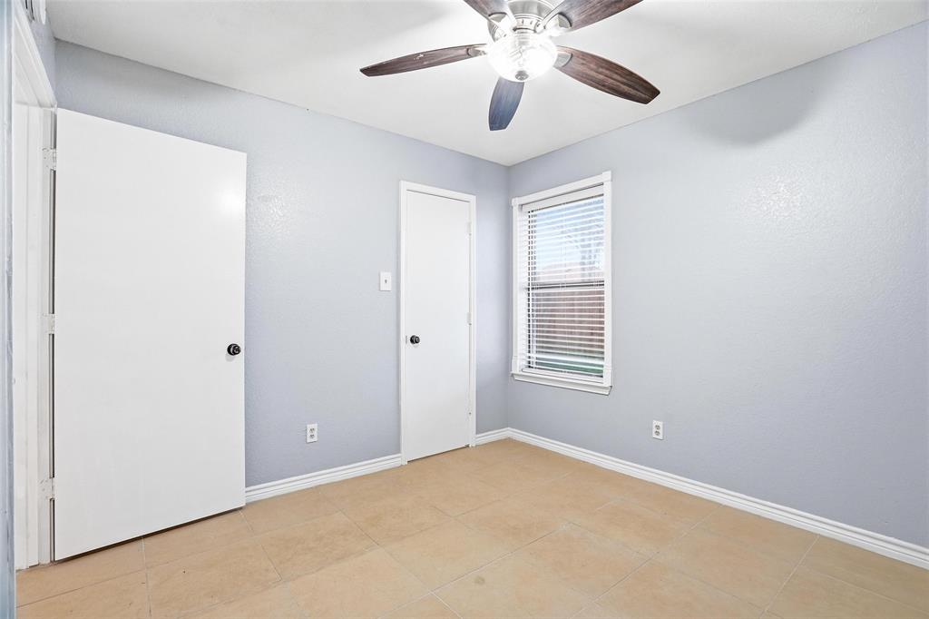 416 Colonial Place Everman, TX 76140 - Photo 10 of 39 a view of an empty room with a window