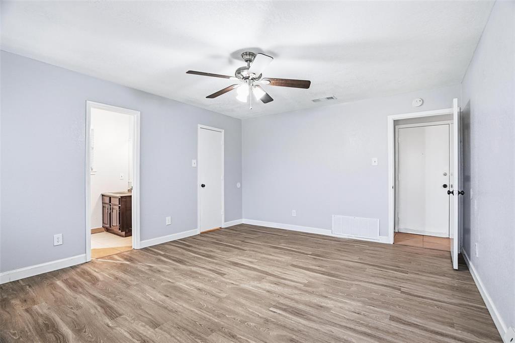 416 Colonial Place Everman, TX 76140 - Photo 12 of 39 a view of empty room with wooden floor