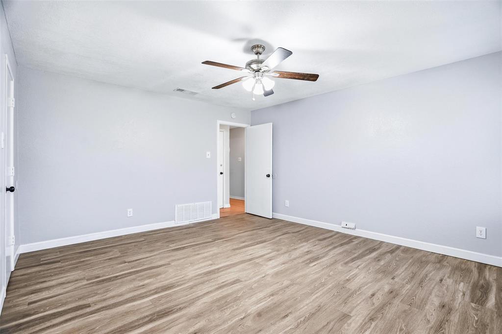 416 Colonial Place Everman, TX 76140 - Photo 13 of 39 wooden floor in an empty room