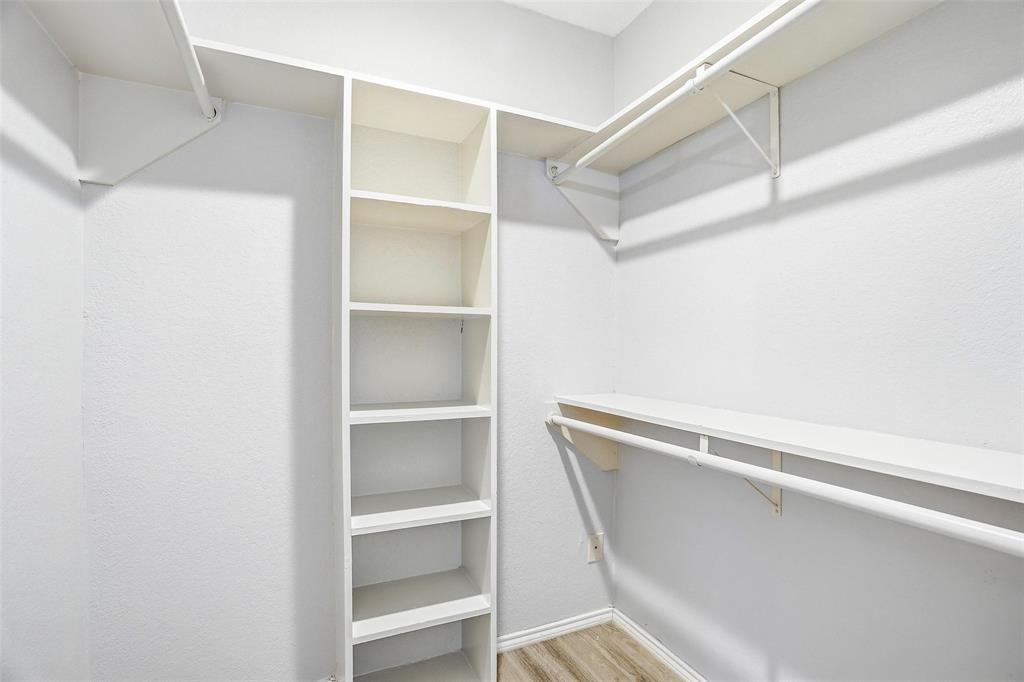 416 Colonial Place Everman, TX 76140 - Photo 15 of 39 a view of an empty walk in closet