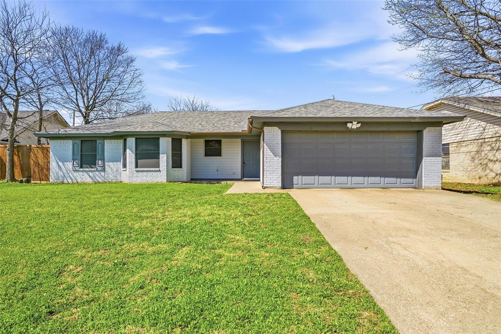 416 Colonial Place Everman, TX 76140 - Photo 2 of 39 a front view of house with yard and green space
