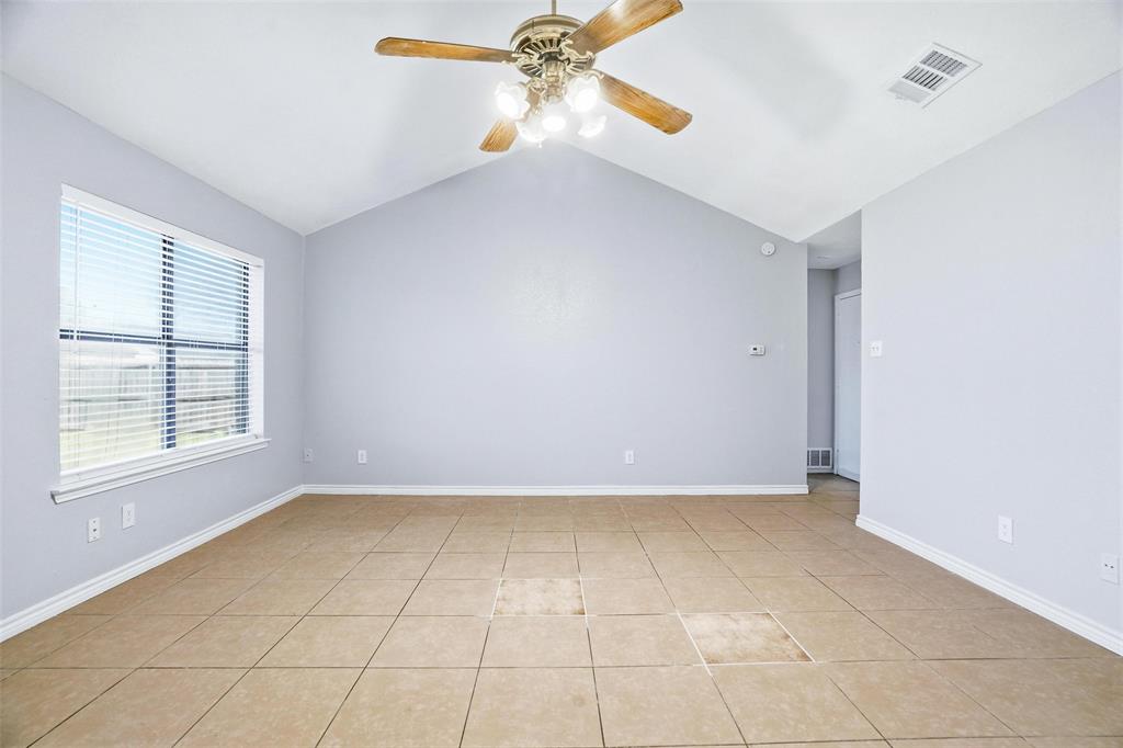 416 Colonial Place Everman, TX 76140 - Photo 20 of 39 wooden floor in an empty room with a window