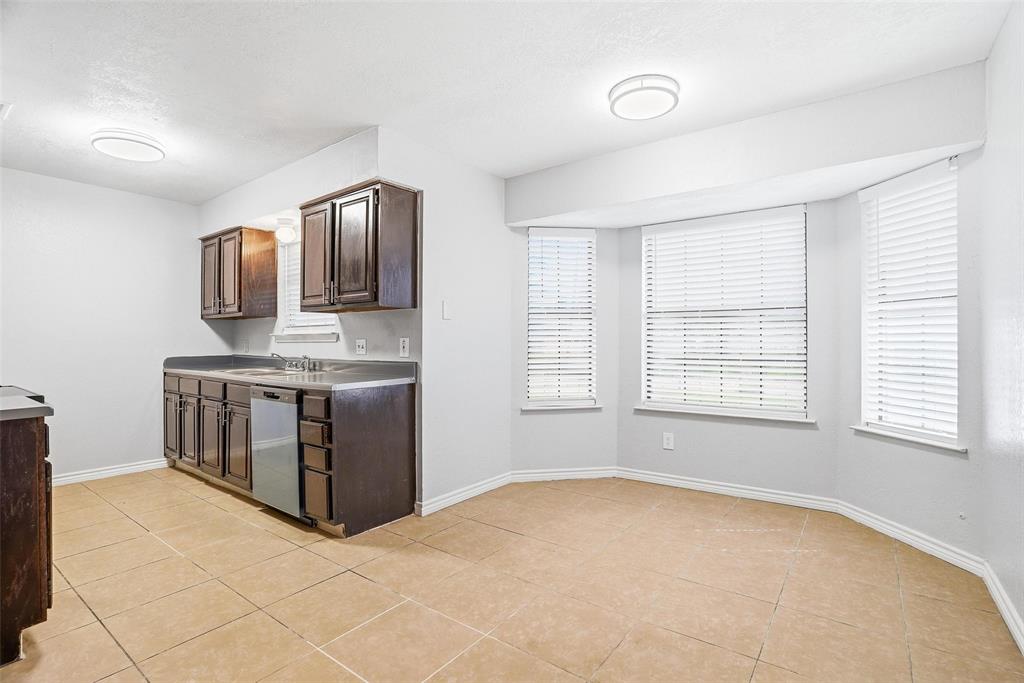 416 Colonial Place Everman, TX 76140 - Photo 25 of 39 a spacious bathroom with a tub sink vanity and mirror