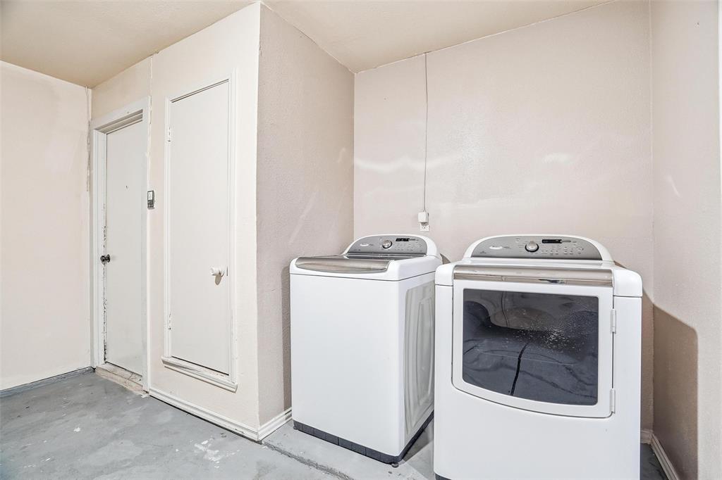 416 Colonial Place Everman, TX 76140 - Photo 33 of 39 a utility room with dryer and washer