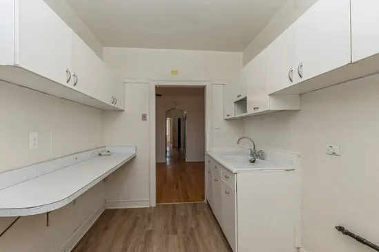 a hallway with washer and dryer