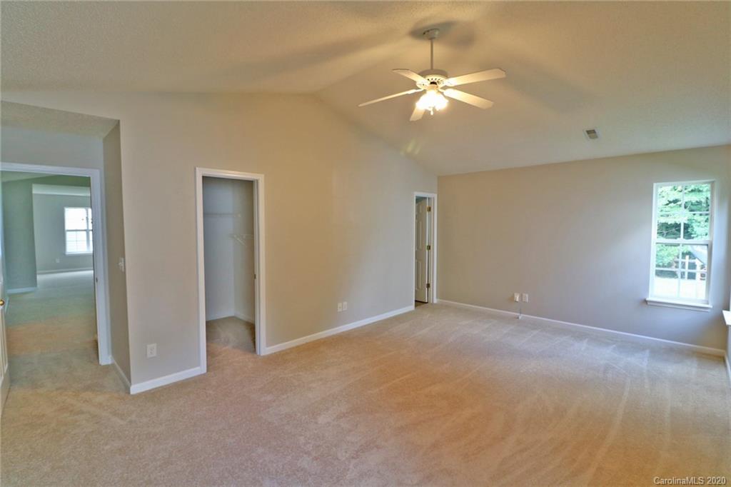 1911 Decatur Court Charlotte, NC 28213 - Photo 12 of 16 an empty room with fan and windows