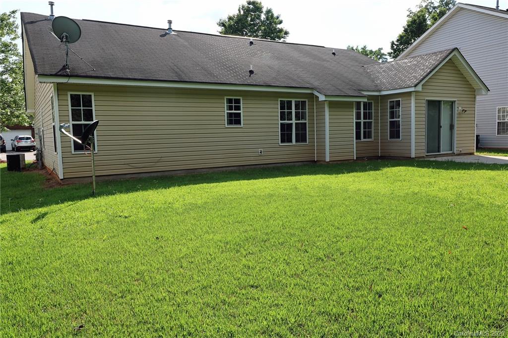1911 Decatur Court Charlotte, NC 28213 - Photo 15 of 16 a front view of a house with garden