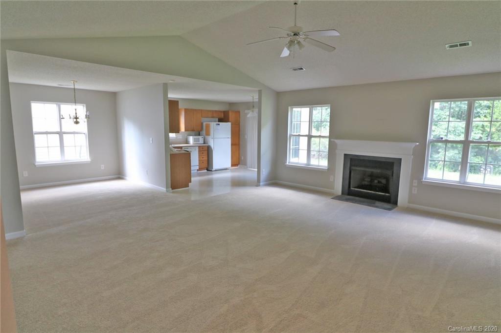 1911 Decatur Court Charlotte, NC 28213 - Photo 4 of 16 a view of a livingroom with an empty space and a fireplace