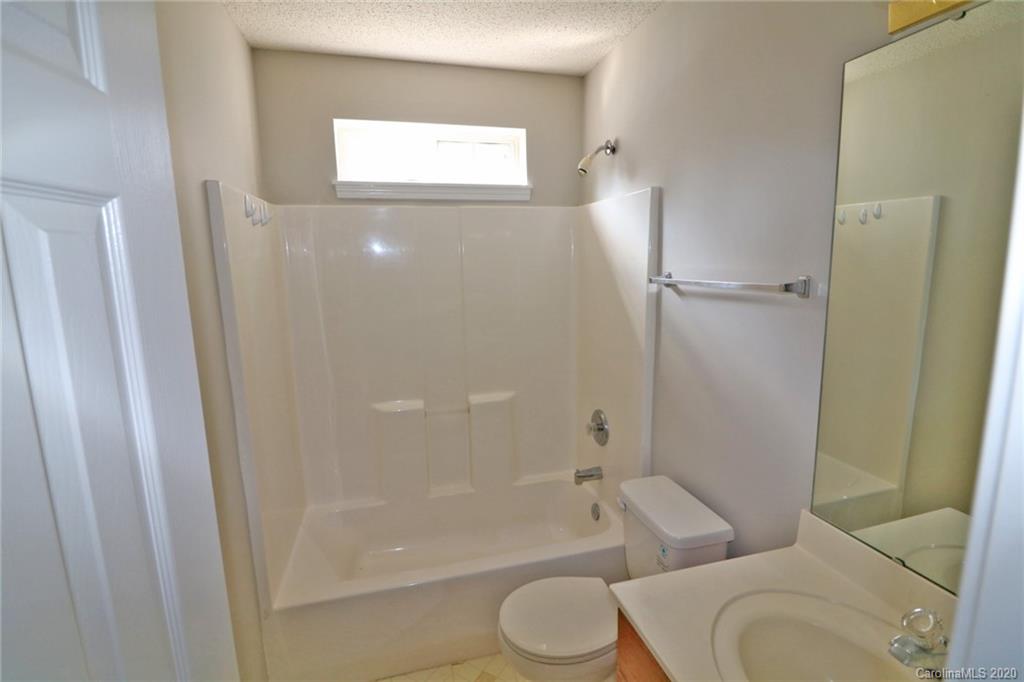 1911 Decatur Court Charlotte, NC 28213 - Photo 10 of 16 a bathroom with a toilet and a bathtub