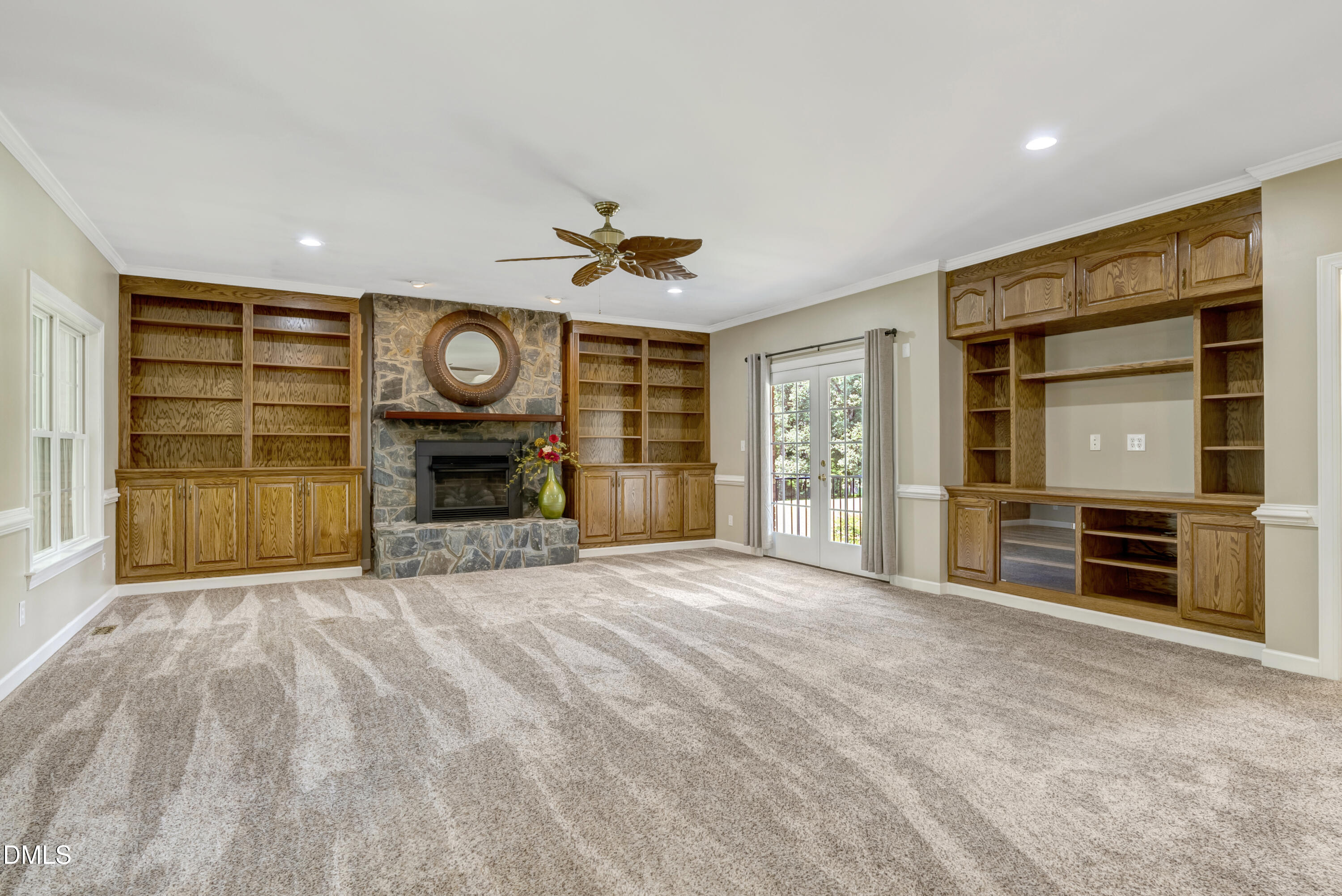 1086 Roberts Chapel Road Stem, NC 27581 - Photo 24 of 33 a view of an empty room with a fireplace and a window