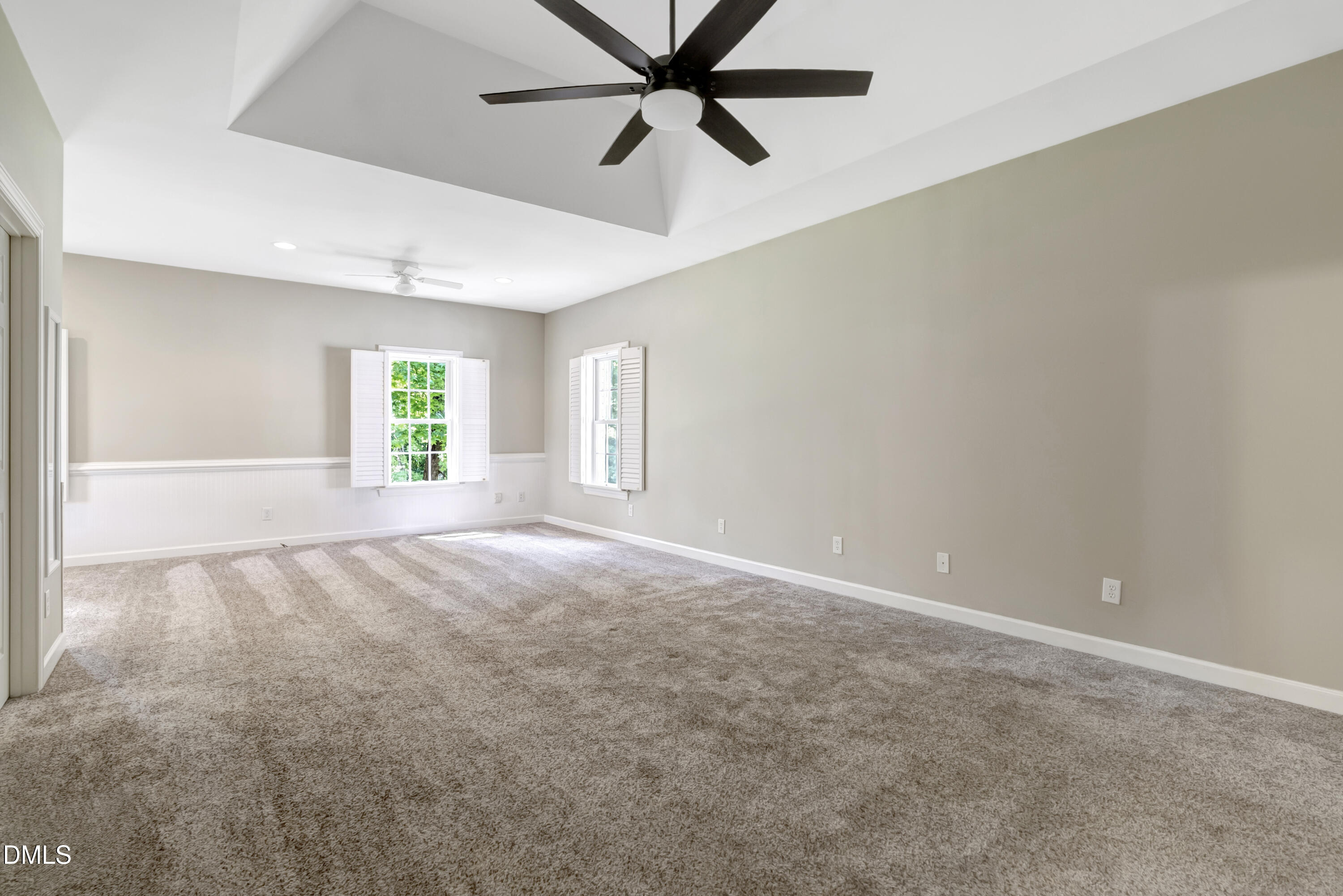1086 Roberts Chapel Road Stem, NC 27581 - Photo 27 of 33 an empty room with windows and fan