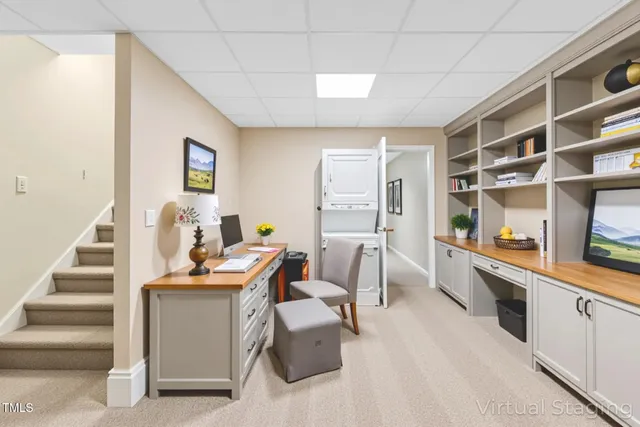 a living room with furniture two window and a table