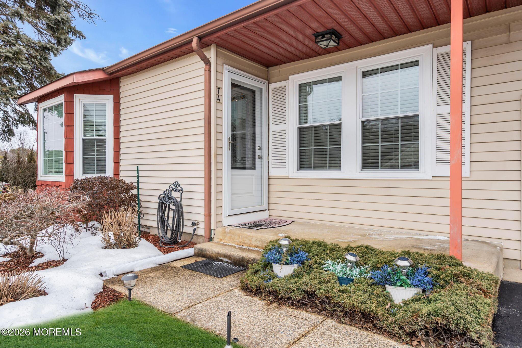 7A Amherst Road, Unit A Whiting, NJ 08759 - Photo 15 of 18 a front view of a house with garden
