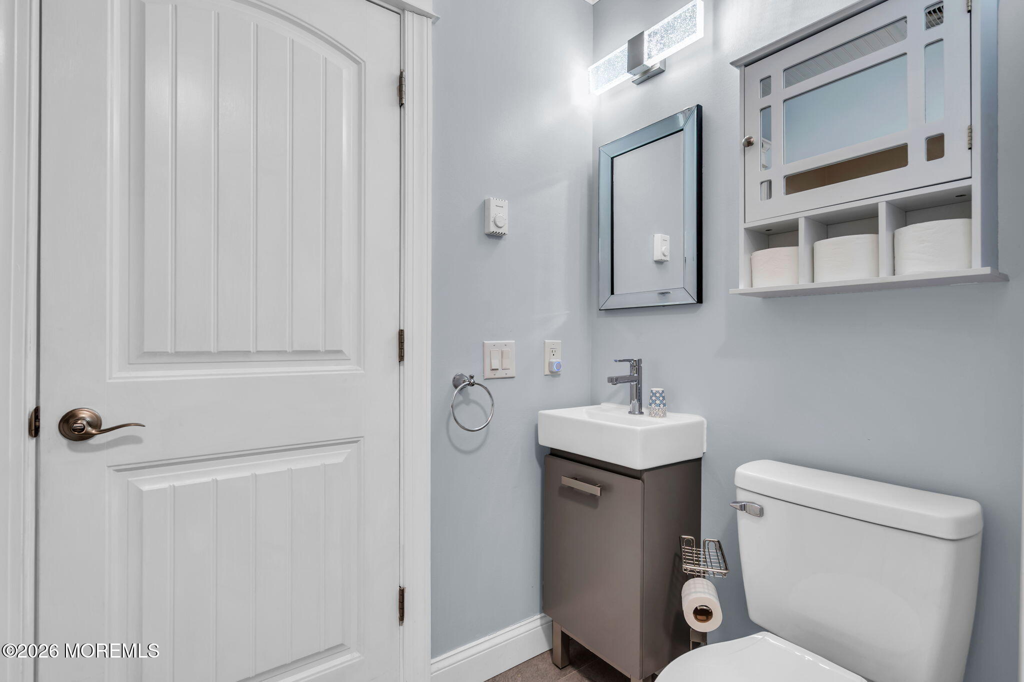 7A Amherst Road, Unit A Whiting, NJ 08759 - Photo 3 of 18 a bathroom with a sink toilet and mirror