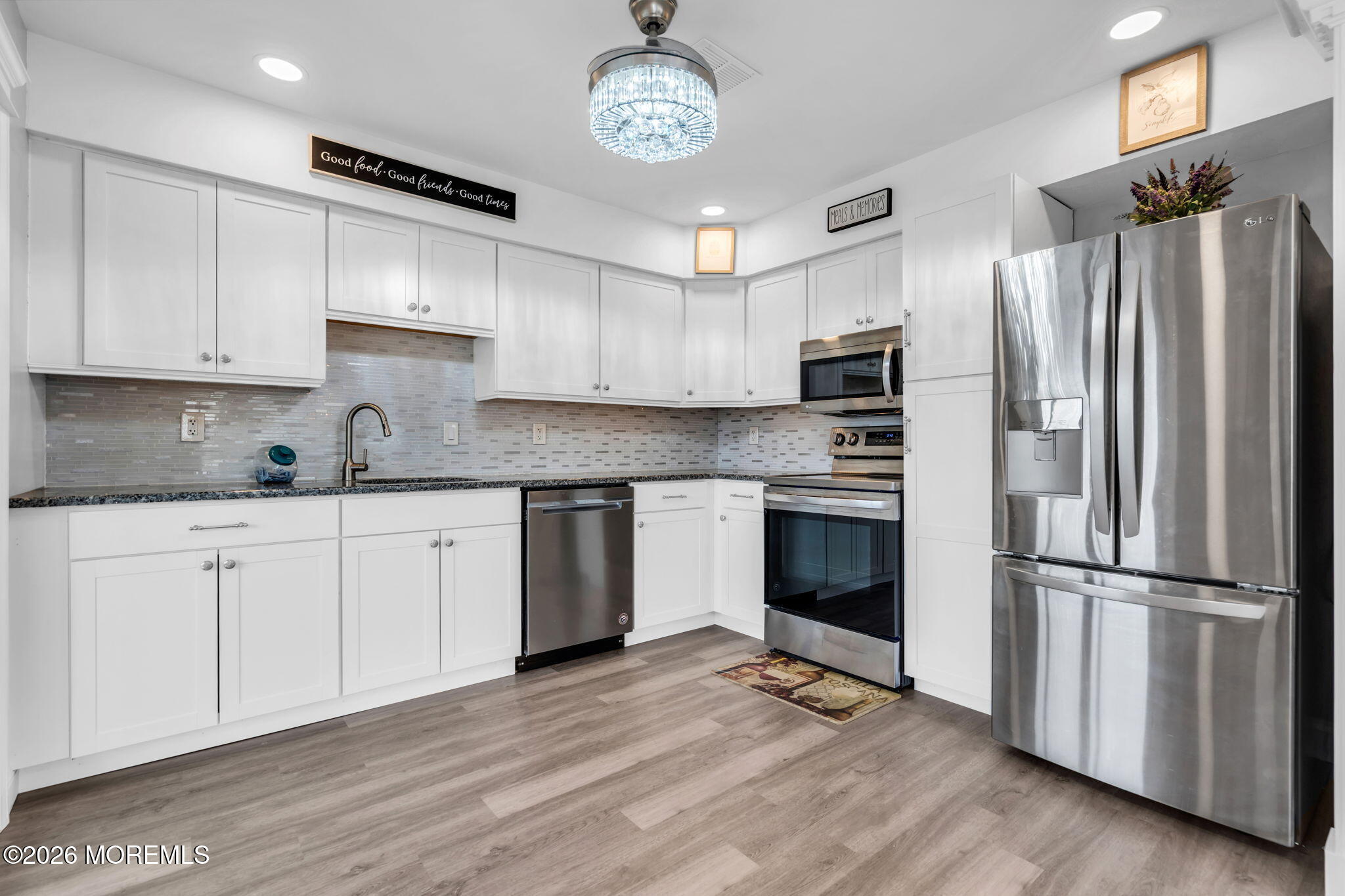 7A Amherst Road, Unit A Whiting, NJ 08759 - Photo 7 of 18 a kitchen with granite countertop a refrigerator oven a sink and cabinets