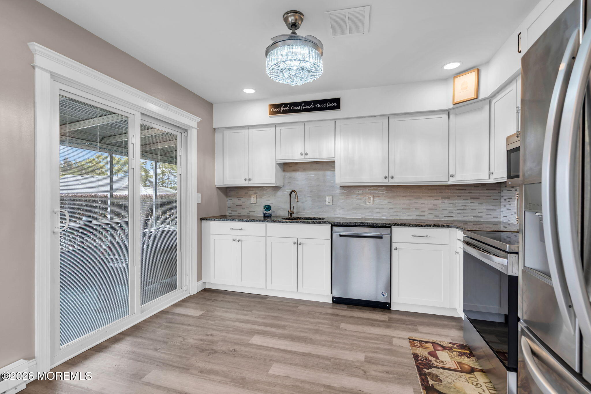 7A Amherst Road, Unit A Whiting, NJ 08759 - Photo 8 of 18 a kitchen with stainless steel appliances granite countertop a stove a refrigerator and a granite counter tops