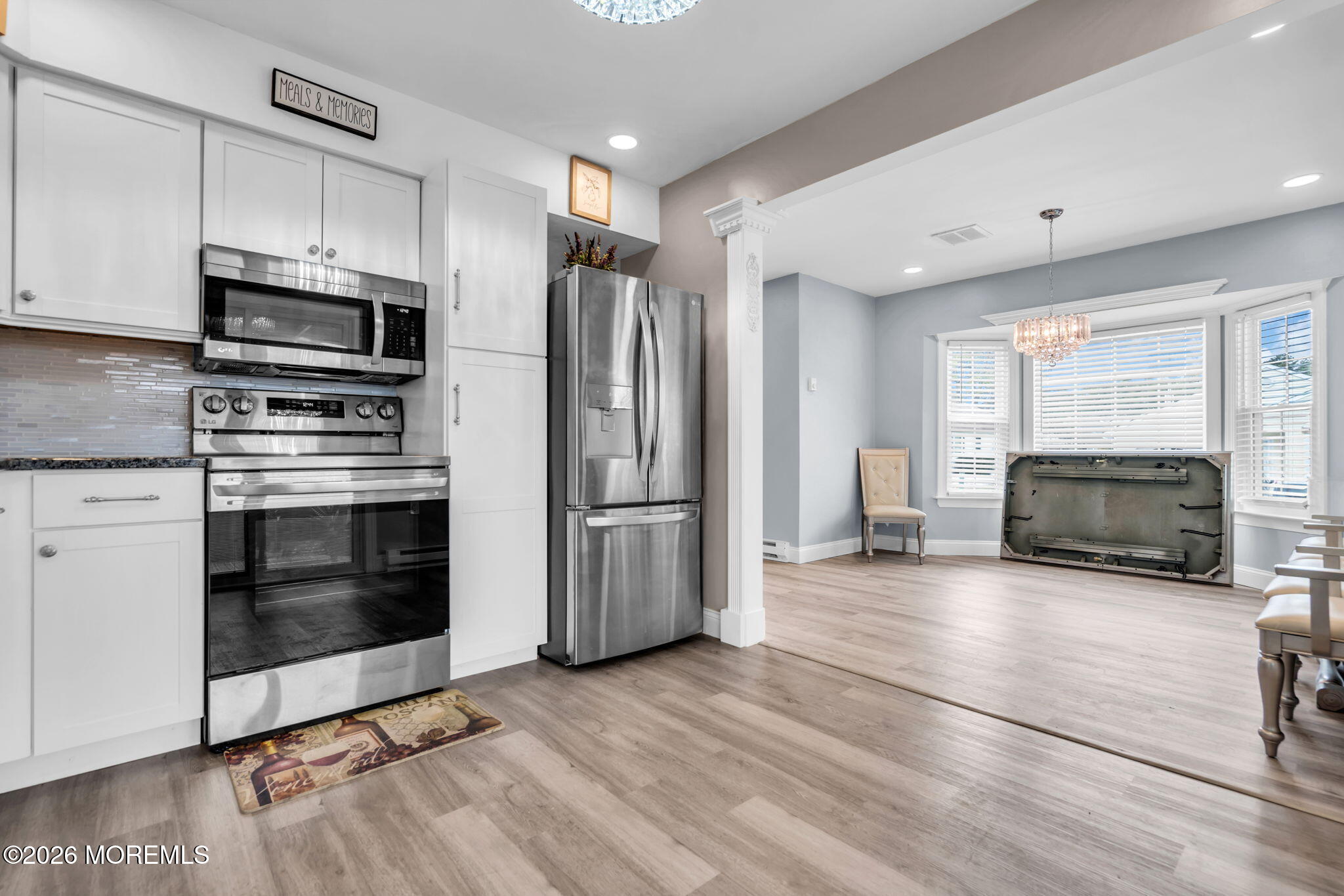 7A Amherst Road, Unit A Whiting, NJ 08759 - Photo 9 of 18 a kitchen with granite countertop a stove a microwave and refrigerator