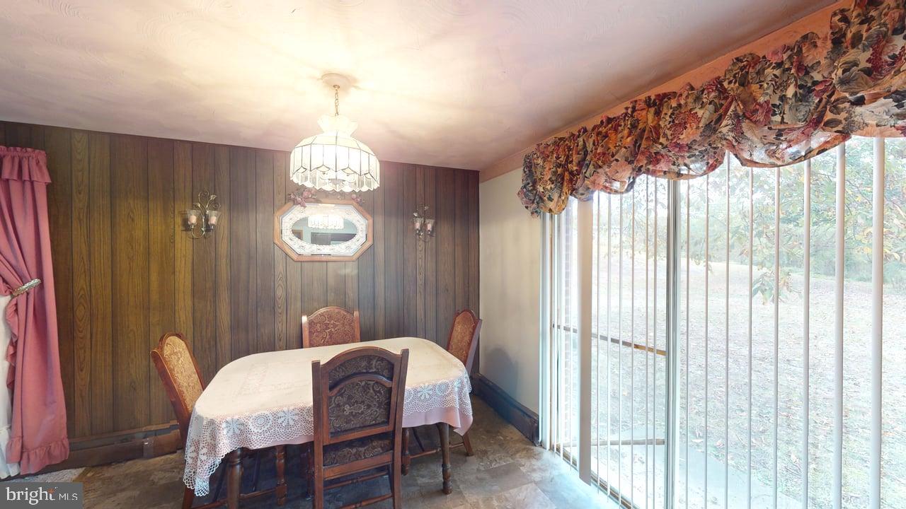 4549 Georges Run Road Ridgeley, WV 26753 - Photo 13 of 48 a view of a dining room with furniture and window