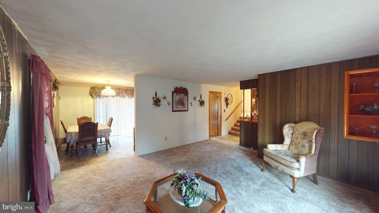 4549 Georges Run Road Ridgeley, WV 26753 - Photo 17 of 48 a living room with furniture and a chair