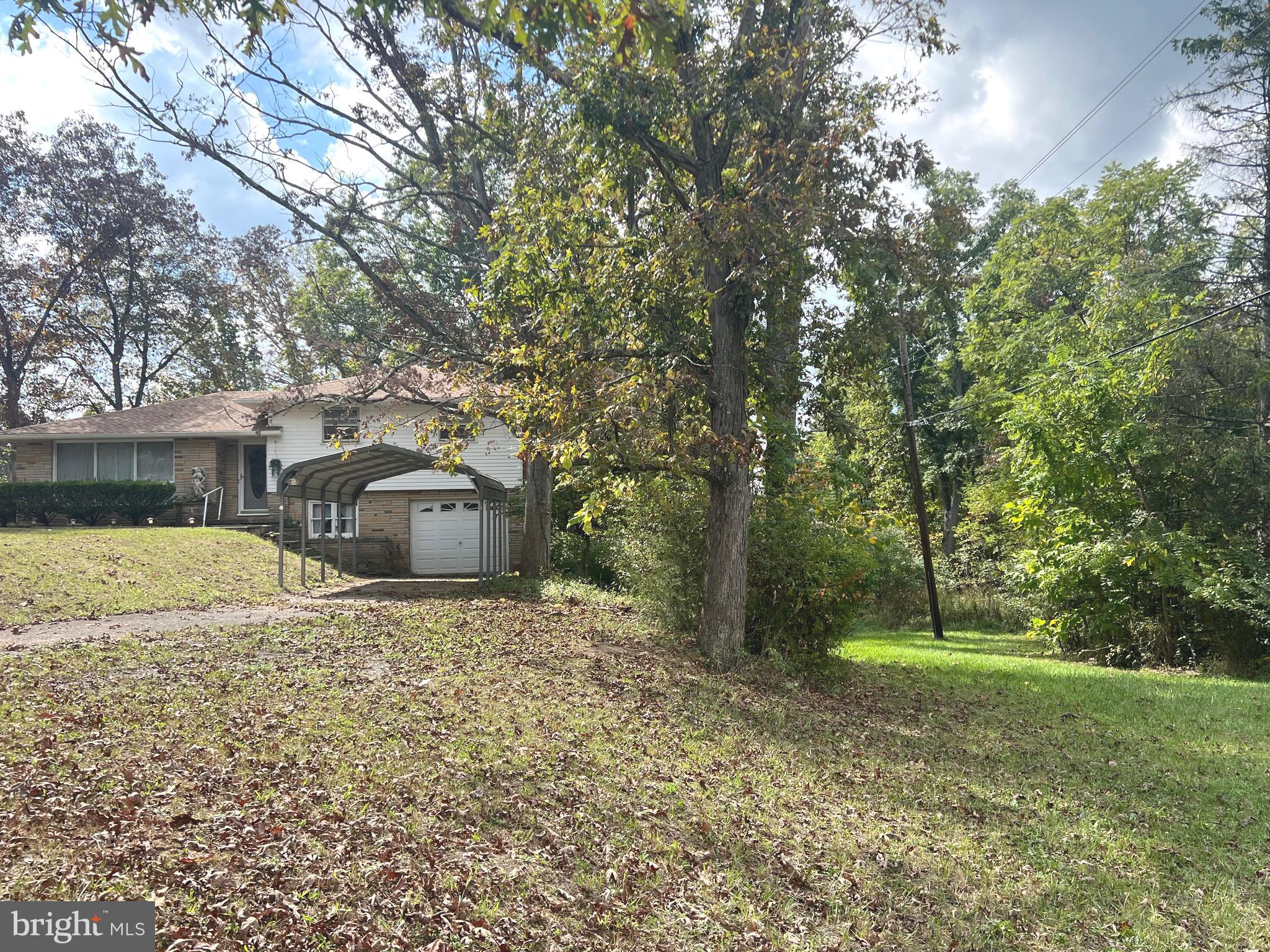 4549 Georges Run Road Ridgeley, WV 26753 - Photo 2 of 48 a backyard of a house with lots of green space
