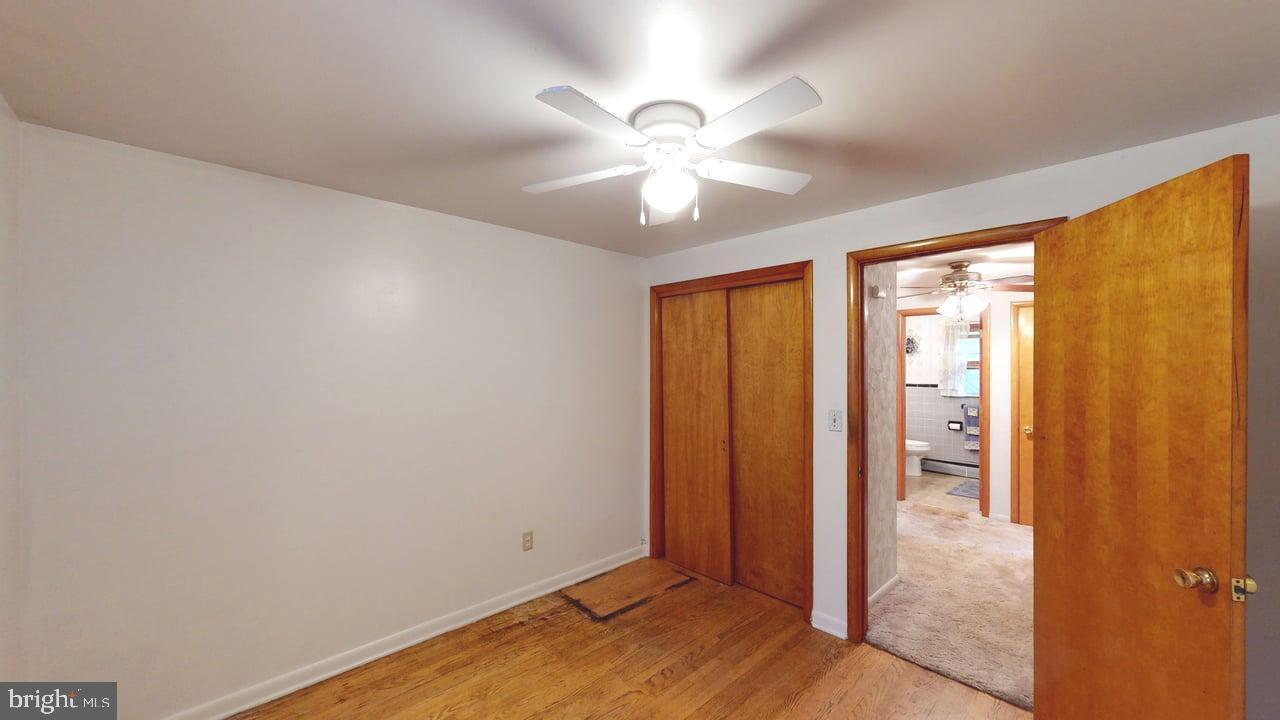 4549 Georges Run Road Ridgeley, WV 26753 - Photo 34 of 48 wooden floor in an empty room with a window