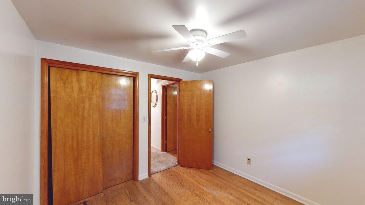 4549 Georges Run Road Ridgeley, WV 26753 - Photo 35 of 48 a view of an empty room with wooden floor and a window