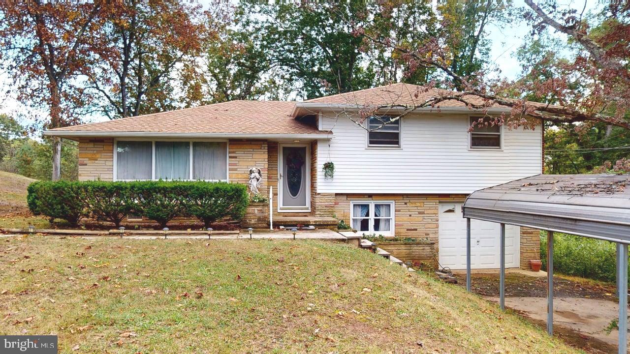 4549 Georges Run Road Ridgeley, WV 26753 - Photo 43 of 48 a view of a house with backyard and sitting area