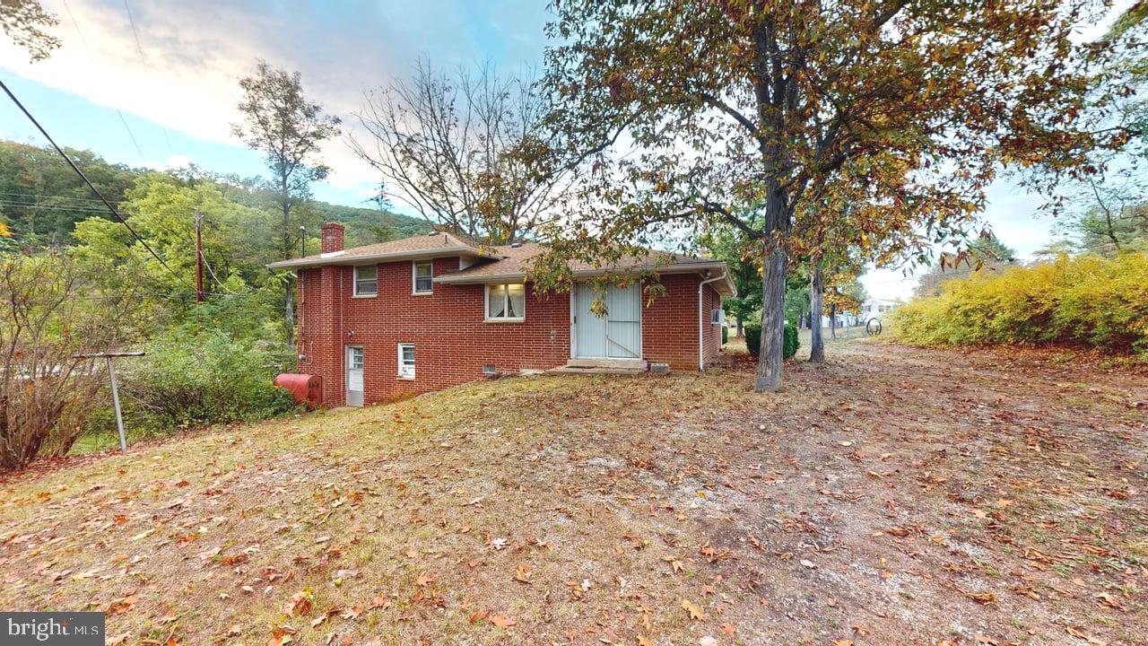 4549 Georges Run Road Ridgeley, WV 26753 - Photo 8 of 48 a front view of a house with a yard