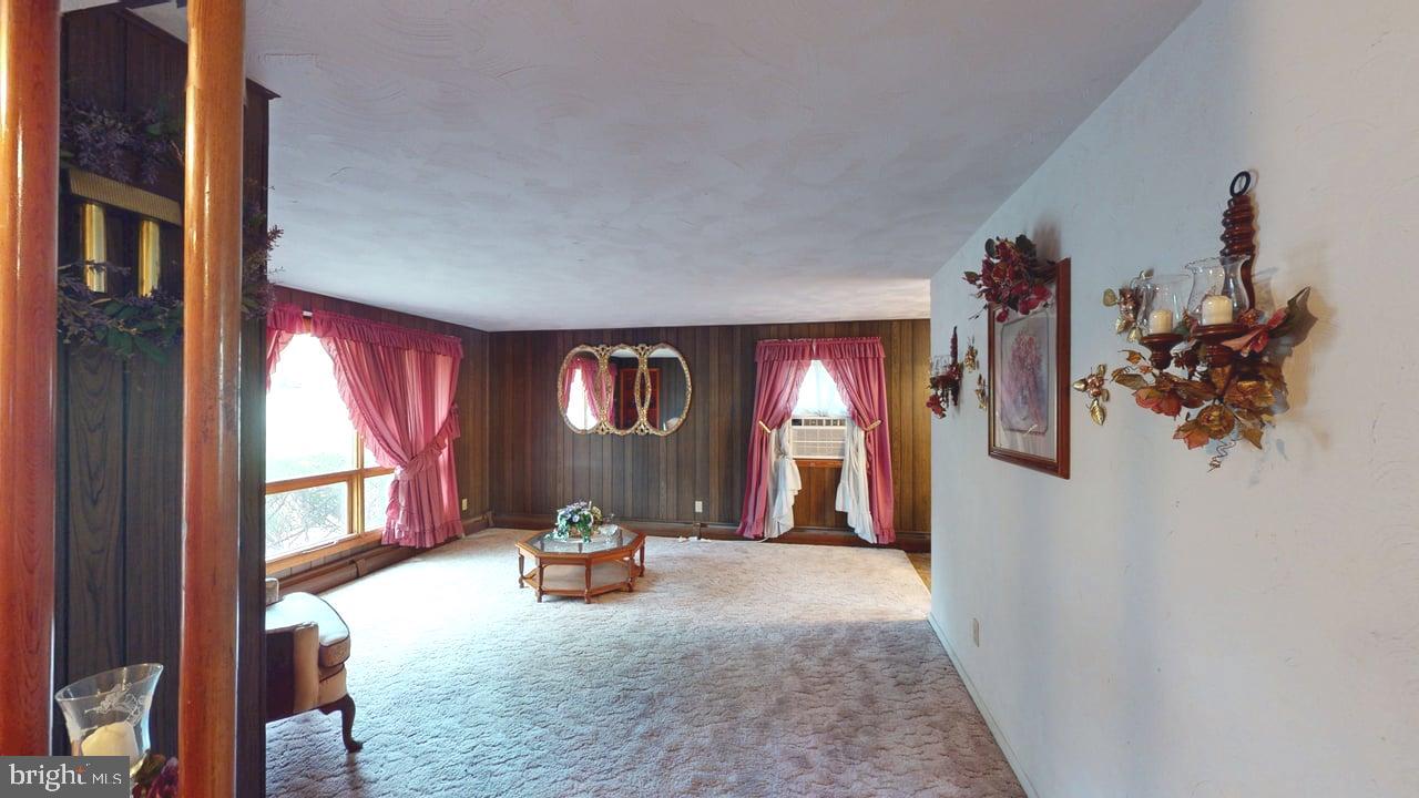 4549 Georges Run Road Ridgeley, WV 26753 - Photo 10 of 48 a view of a livingroom with furniture hardwood floor and a window