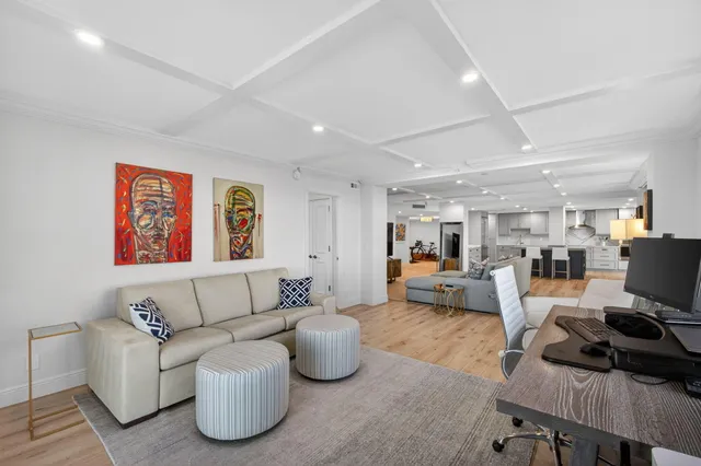 a bathroom with a granite countertop sink mirror and stainless steel appliances
