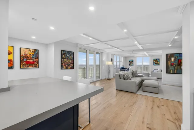 a en suite bathroom with a granite countertop sink and a mirror