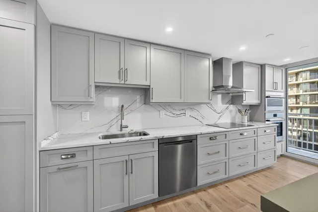 a spacious bedroom with a bed and a window