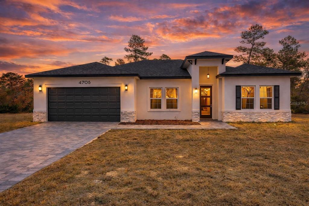 front view of a house with a yard