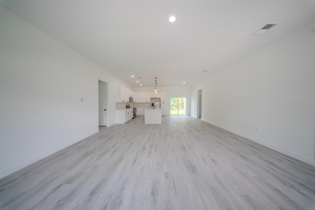 4705 Southwest 159th Lane Ocala, FL 34473 - Photo 11 of 28 a view of empty room with wooden floor