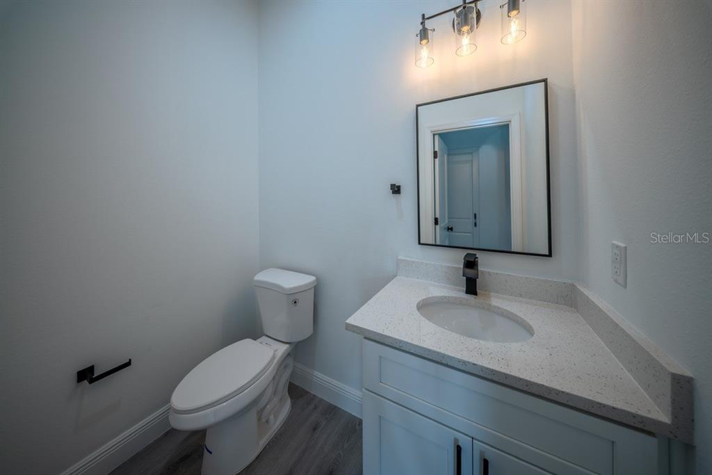 4705 Southwest 159th Lane Ocala, FL 34473 - Photo 14 of 28 a bathroom with a toilet sink and mirror