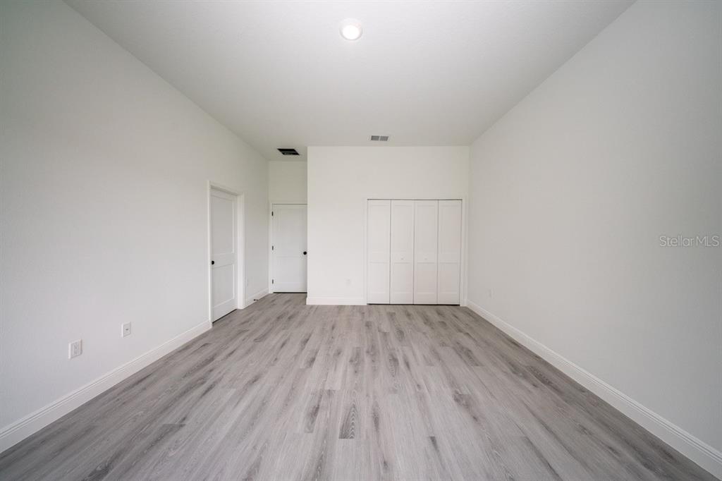 4705 Southwest 159th Lane Ocala, FL 34473 - Photo 20 of 28 a view of an empty room with wooden floor