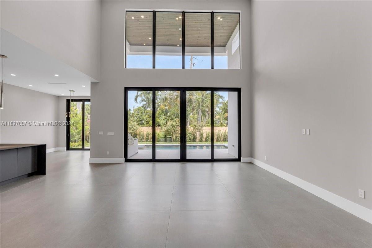751 Northeast 2nd Street Boca Raton, FL 33432 - Photo 14 of 56 a view of an empty room with window and wooden floor