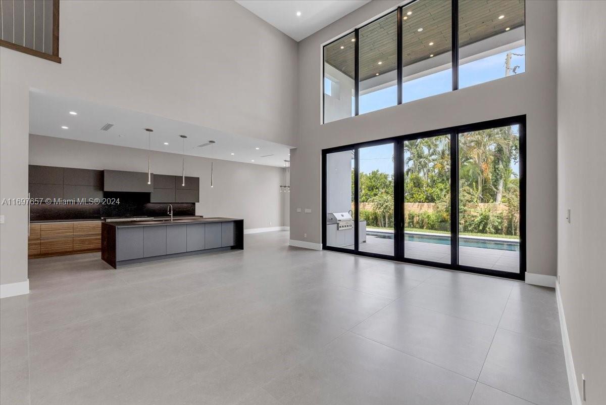 751 Northeast 2nd Street Boca Raton, FL 33432 - Photo 15 of 56 a view of kitchen with furniture and floor to ceiling window