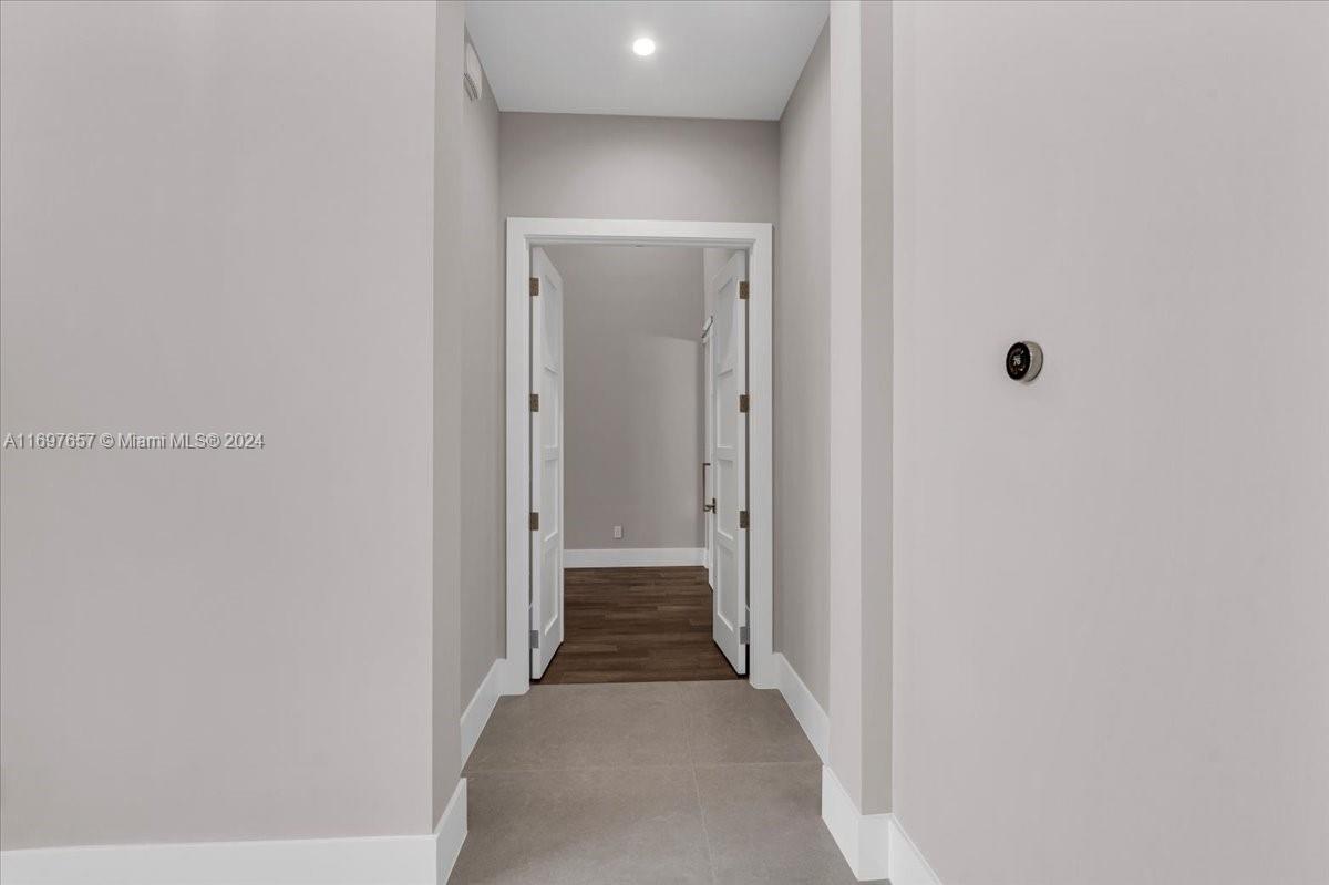 751 Northeast 2nd Street Boca Raton, FL 33432 - Photo 23 of 56 a view of a hallway with wooden floor