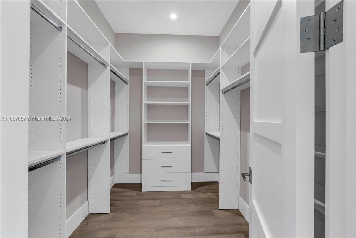 751 Northeast 2nd Street Boca Raton, FL 33432 - Photo 25 of 56 a view of walk in closet with empty racks