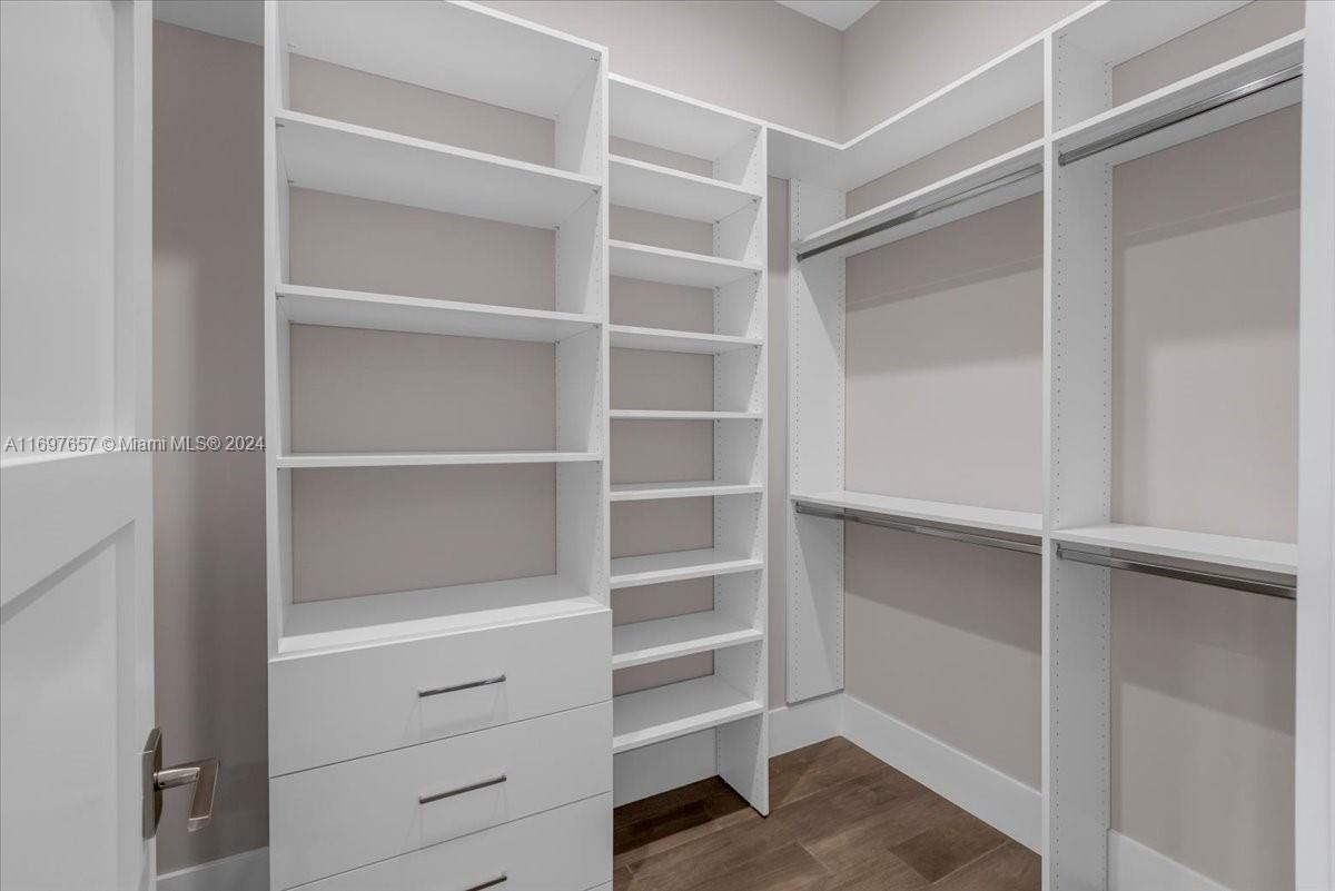 751 Northeast 2nd Street Boca Raton, FL 33432 - Photo 26 of 56 a view of walk in closet with empty racks