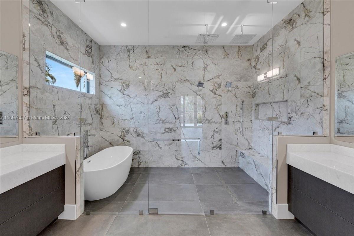 751 Northeast 2nd Street Boca Raton, FL 33432 - Photo 30 of 56 a spacious bathroom with a toilet a sink and bathtub