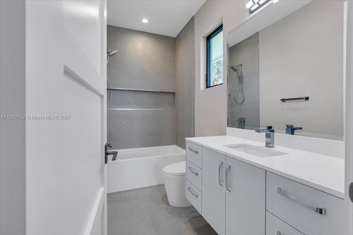 751 Northeast 2nd Street Boca Raton, FL 33432 - Photo 40 of 56 a bathroom with a sink a toilet and shower